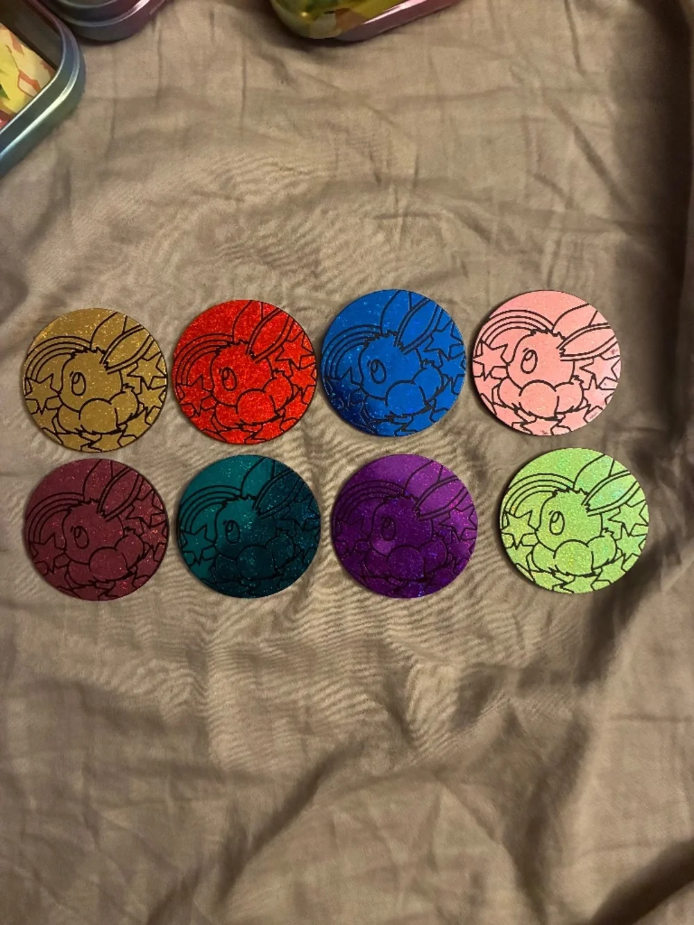 All eight prismatic evolutions Pokémon coins